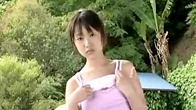 Teenage Japanese girl strips outdoors