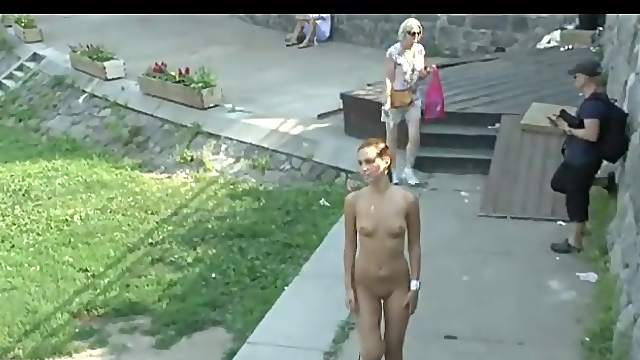 Naked girl with small tits walks the park