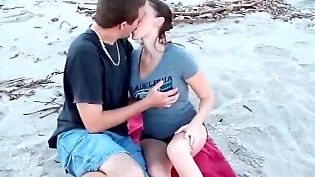 Kissing a cutie that sucks his dick on the beach