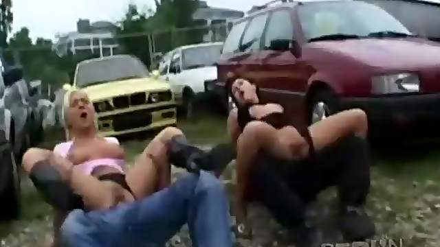 Parking lot fuck features two cock riding babes