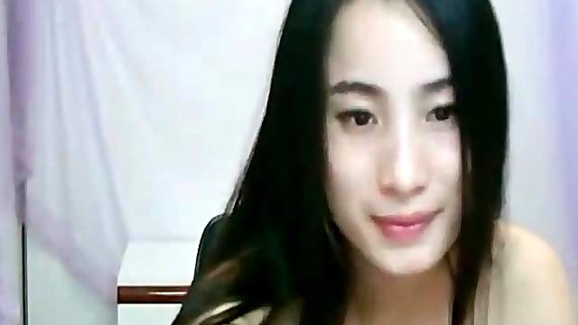 Cute Asian webcam girl models her tits