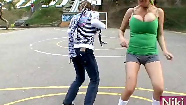 Big breasts girls play soccer outdoors