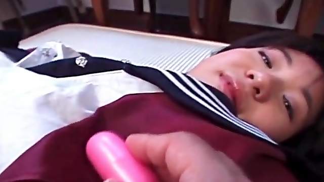 Vibrator arouses her little Japanese titties