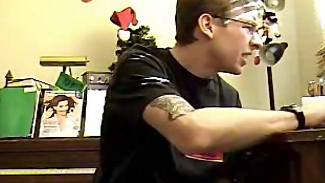 Tattooed boy in glasses jerks off solo