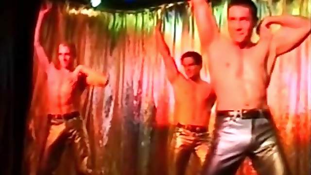 Come to the club as male dancers work the stage