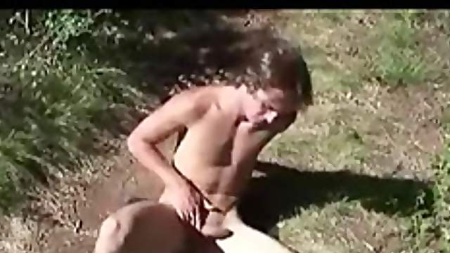Naked boy working his cock by the lake